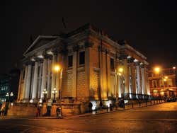 The façade of Dublin City Hall lit up at night